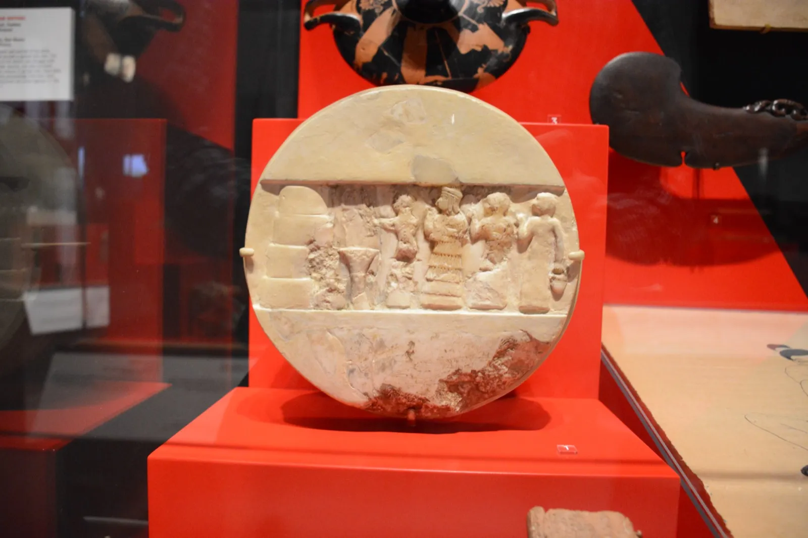 The Disk of Enheduanna, a round limestone relief showing a priestess and attendants at an altar