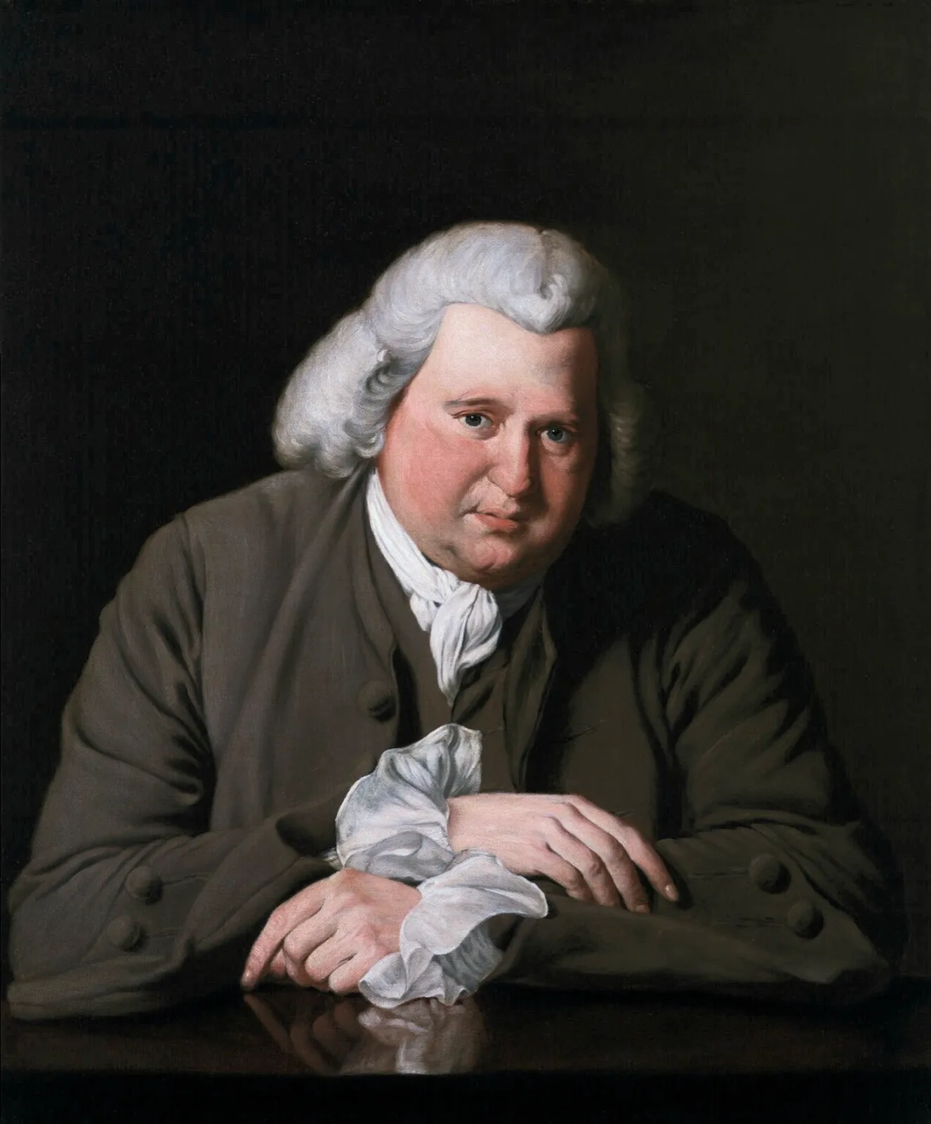 A portrait of a heavy-set man in a grey wig and brown coat, leaning on a polished table with his hands folded over a white handkerchief