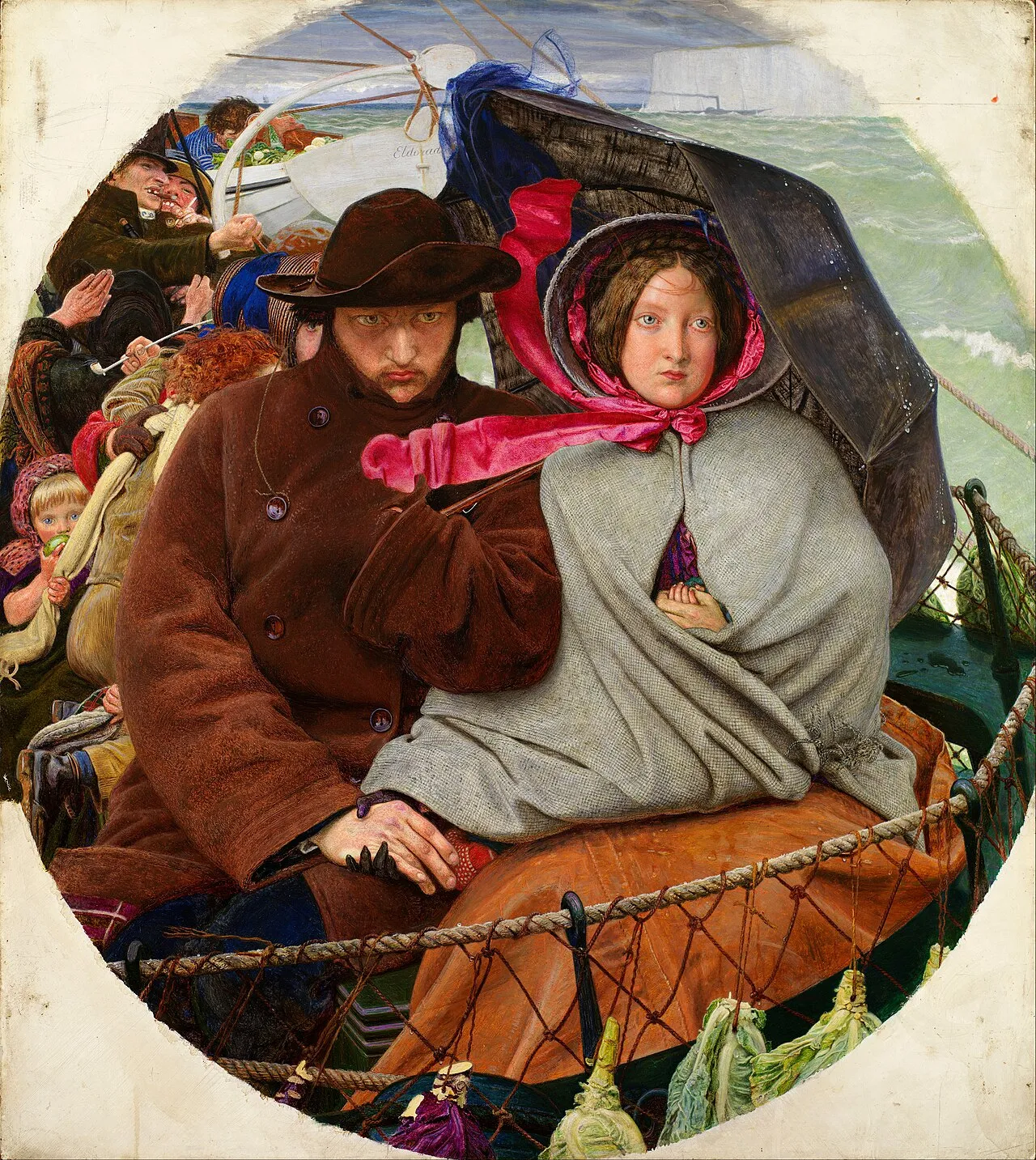 A young couple sit huddled together on the deck of an emigrant ship, the white cliffs of England behind them, holding hands under a grey shawl