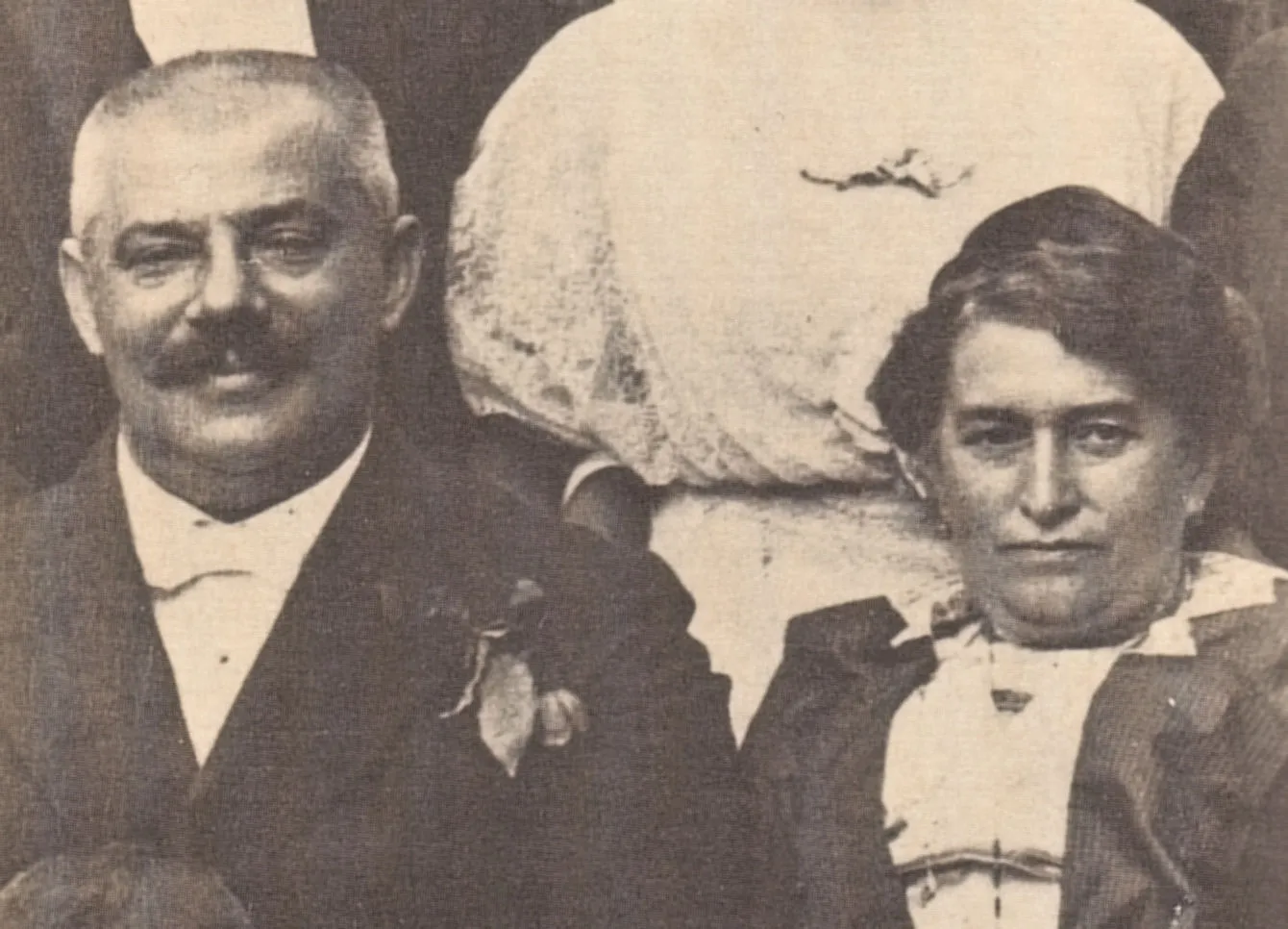 Hermann and Julie Kafka photographed side by side, he smiling with a flower in his lapel, she looking steadily at the camera