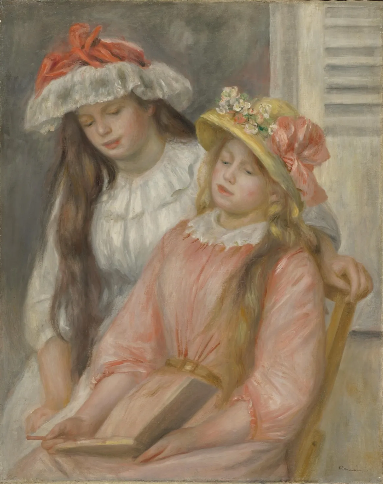 Renoir’s painting of two girls in summer hats, one in white and one in pink, bending over an open album on their laps